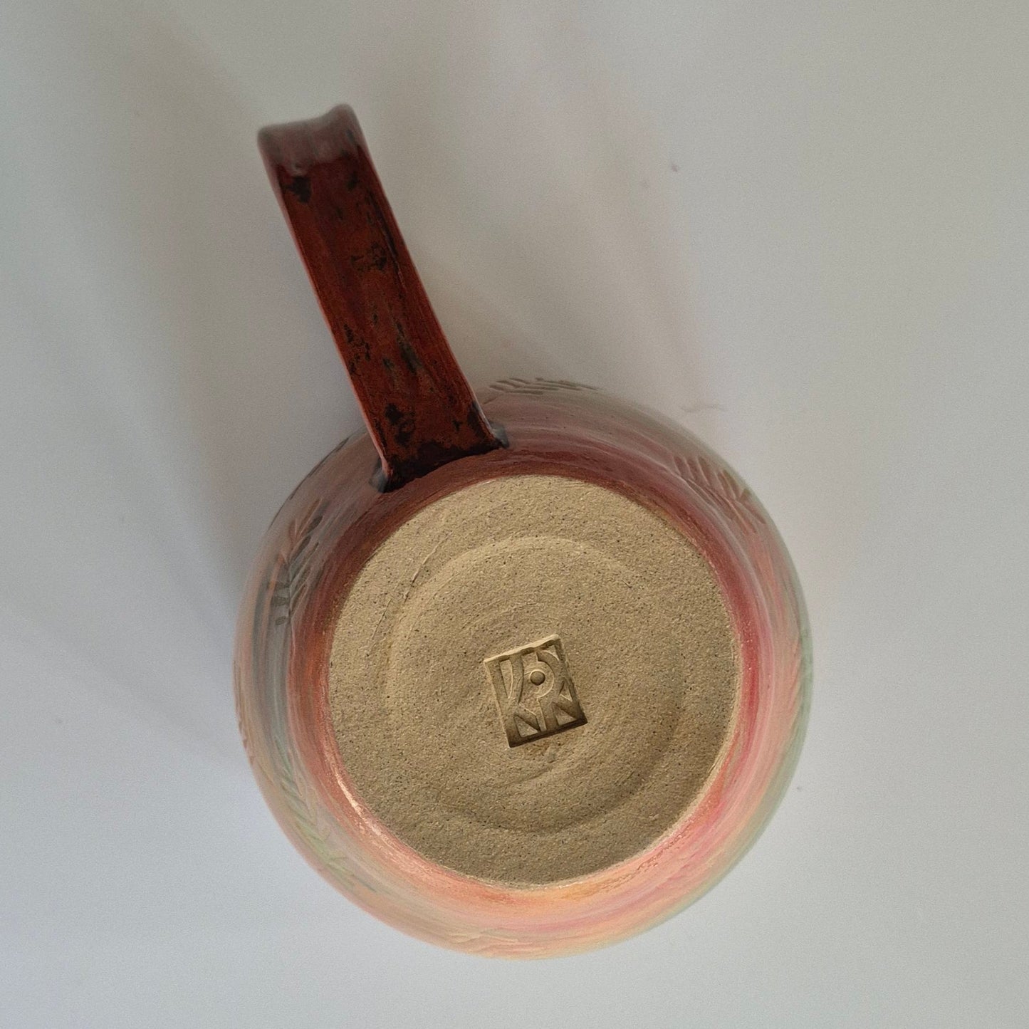 Ceramic mug with a handle on a white background