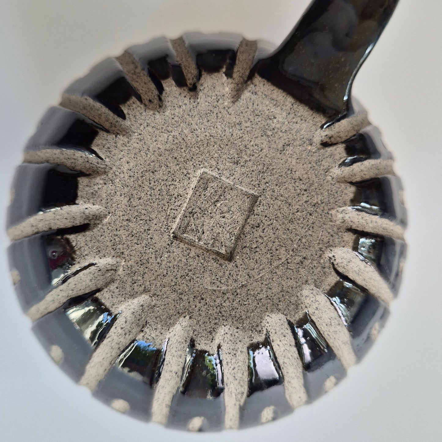Base of a Ceramic mug on a white background