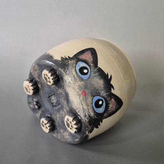 Hand-painted Cat Mug - Archie - showing face & bottom paw details on a plain background