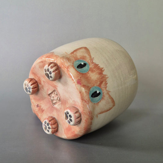 Hand-painted Cat Mug - Amber - showing face & bottom paw details on a plain background