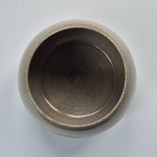 Ceramic pot on a light gray background