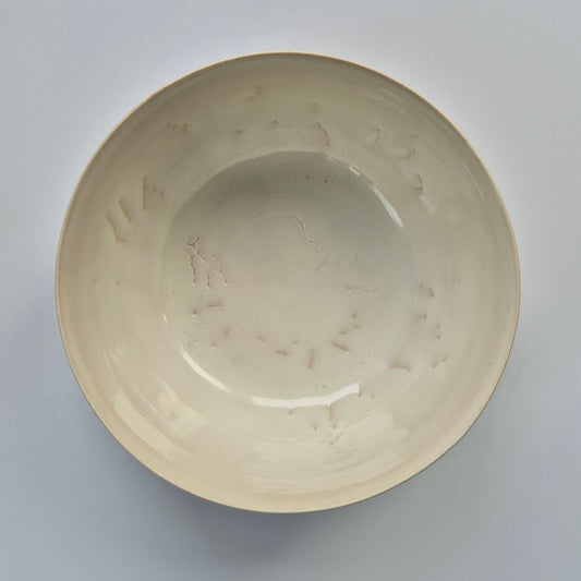 Ceramic bowl with floral patterns on a gray background