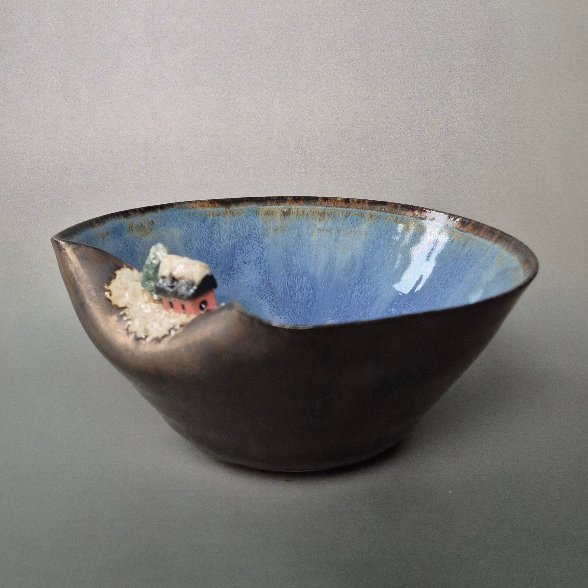 Ceramic bowl with a textured surface on a gray background