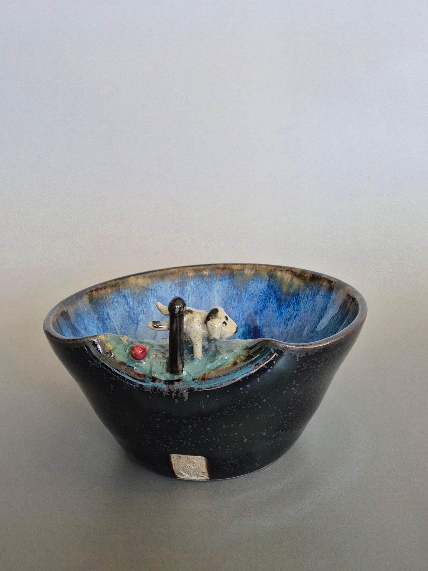 Ceramic bowl with a decorative design on a plain background