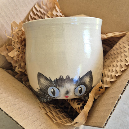 Hand-painted Cat Mug - Alfie - face up in a cardboard box
