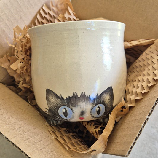 Hand-painted Cat Mug - Alfie - face up in a cardboard box