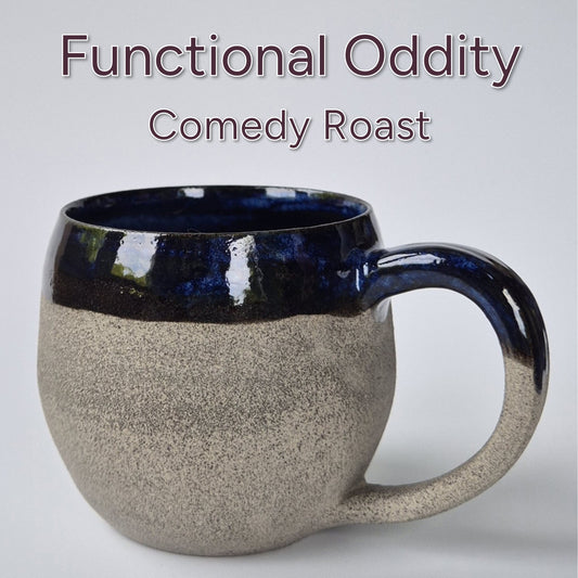 Textured mug with blue interior on a white background, labeled 'Functional Oddity Comedy Roast'.