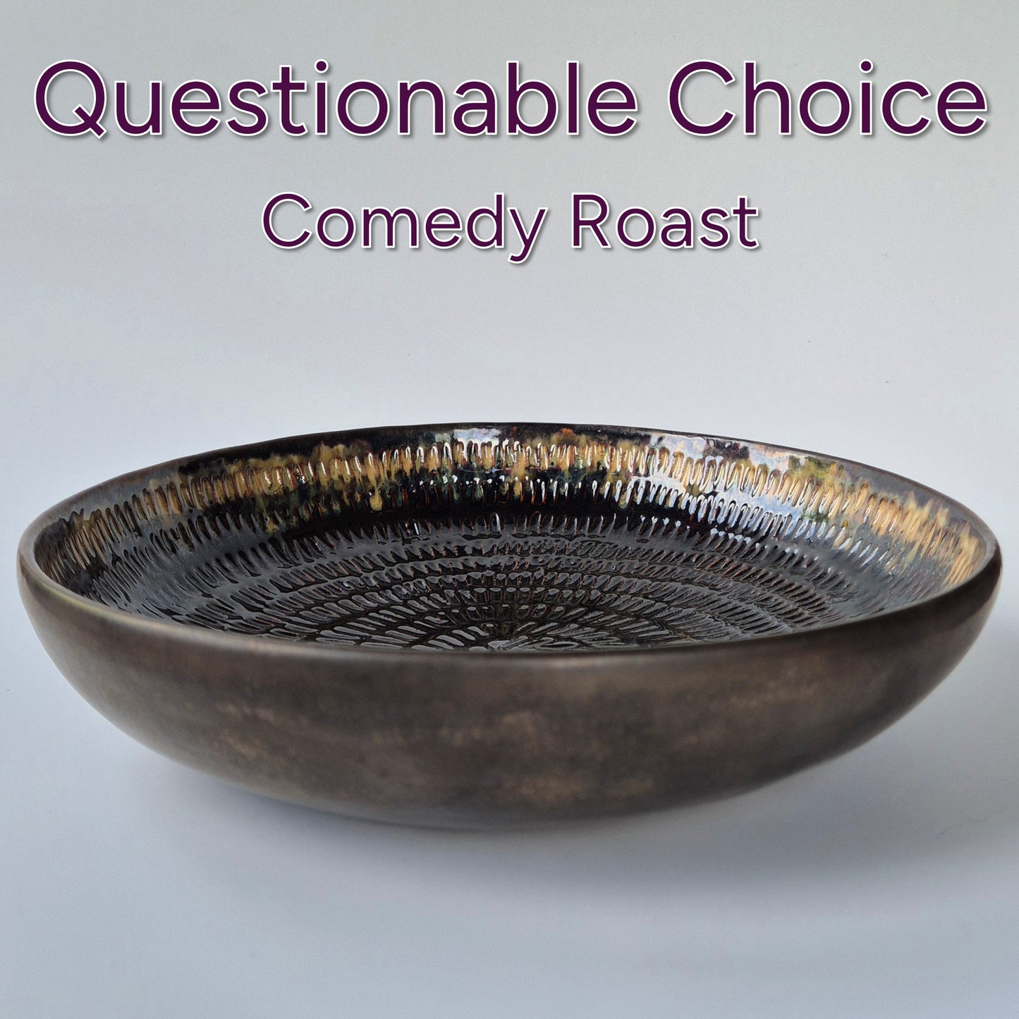 Brown ceramic bowl on a light gray background with text 'Questionable Choice Comedy Roast'.