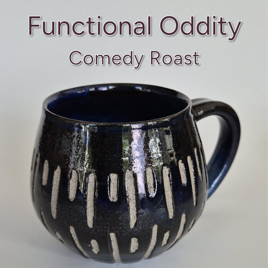Black ceramic mug with carved patterns on a light gray background, featuring text 'Functional Oddity Comedy Roast'.