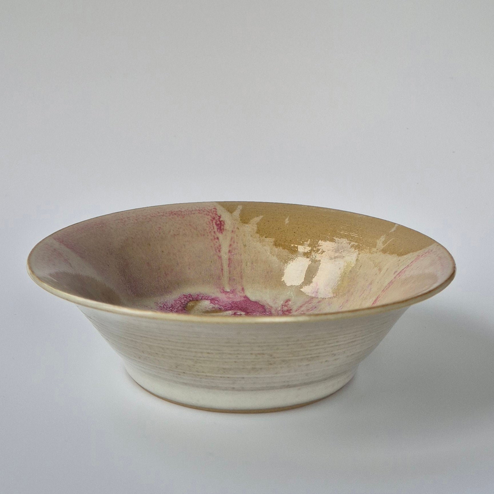 Ceramic bowl with marbled design on a white background