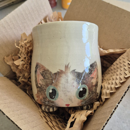Hand-painted Cat Mug - Arlo - face up in a cardboard box