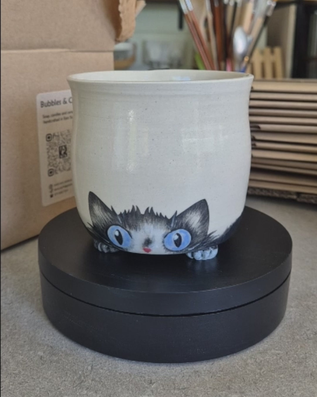 Video of Alfie the ceramic cat mug on an automatic turn-table
