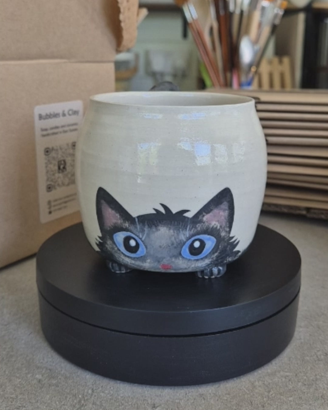 Video of Archie the cat mug on a automatic turntable